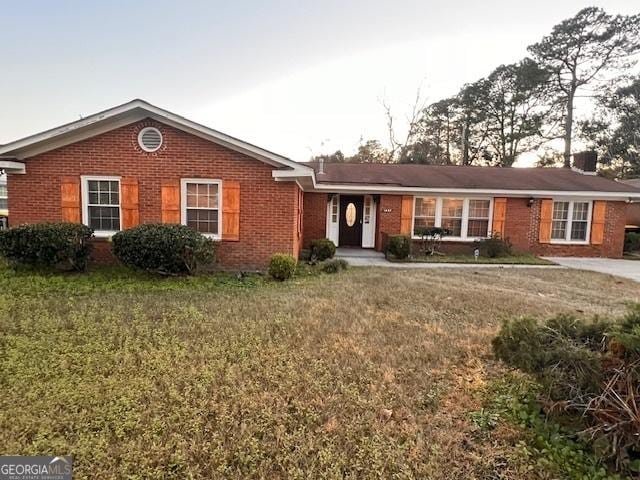 ranch-style house with a front yard