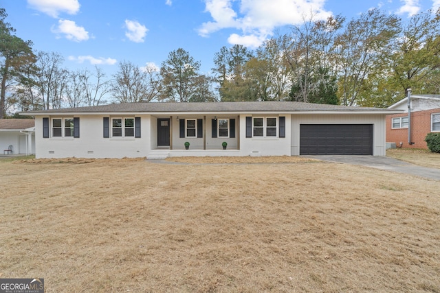 ranch-style home with a porch and a garage