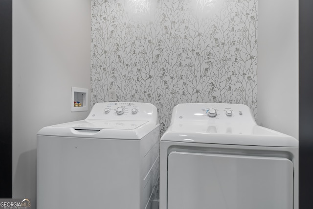 laundry area with washing machine and dryer