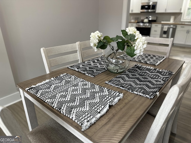 dining room featuring hardwood / wood-style flooring