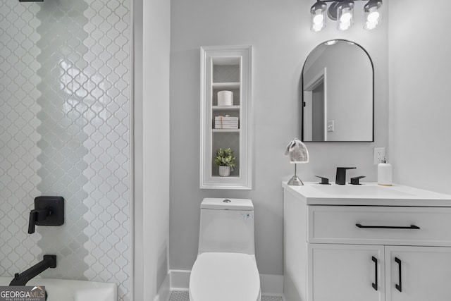 full bathroom with vanity, toilet, and tiled shower / bath combo