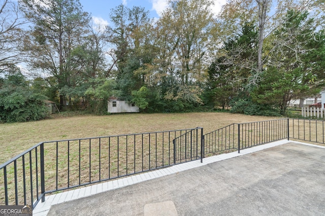 view of patio featuring a shed