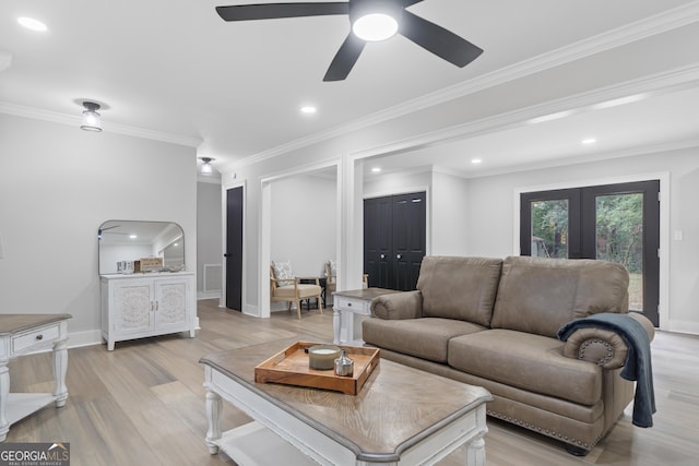 living room with ceiling fan, french doors, light hardwood / wood-style floors, and ornamental molding