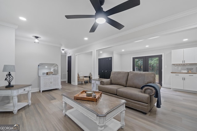 living room with french doors, light hardwood / wood-style flooring, ceiling fan, and ornamental molding