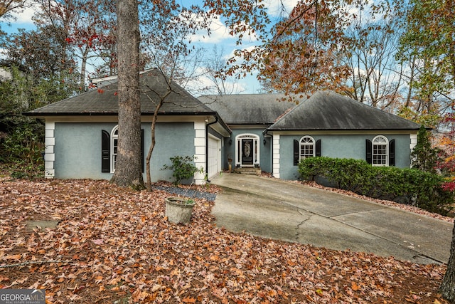 ranch-style home with a garage