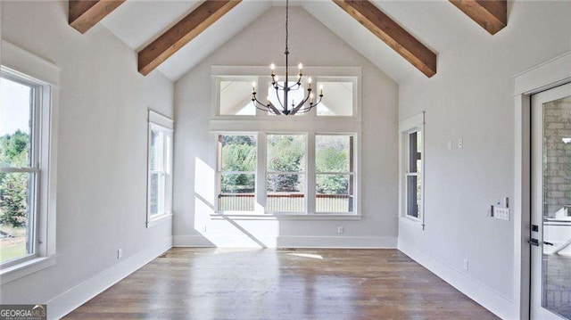 interior space with beamed ceiling, dark wood-type flooring, high vaulted ceiling, and an inviting chandelier