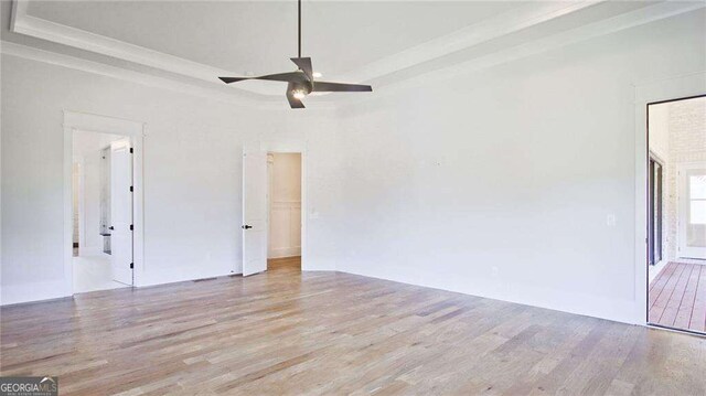 spare room featuring ceiling fan and light wood-type flooring