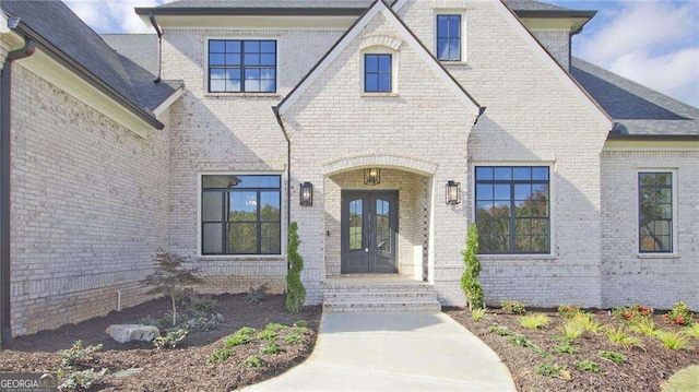 view of exterior entry featuring french doors