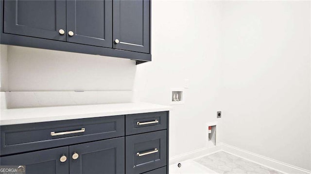 laundry room featuring tile patterned floors, hookup for a washing machine, cabinets, and hookup for an electric dryer