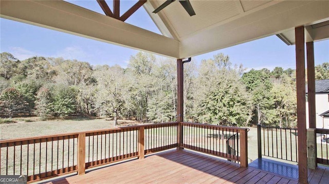 wooden deck featuring ceiling fan