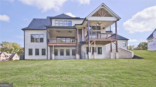 rear view of house featuring a lawn, ceiling fan, cooling unit, and a deck