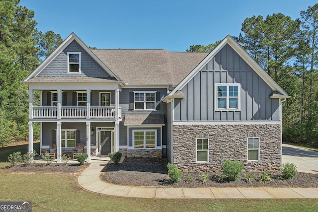 view of front of house with a balcony and a porch