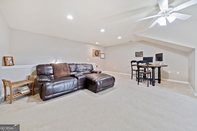 carpeted living room featuring ceiling fan and lofted ceiling