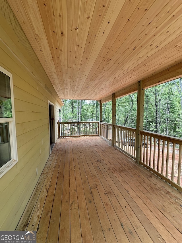 367 Cherokee Trl, Forsyth, GA 31029 - wooden terrace with view of wooded area
