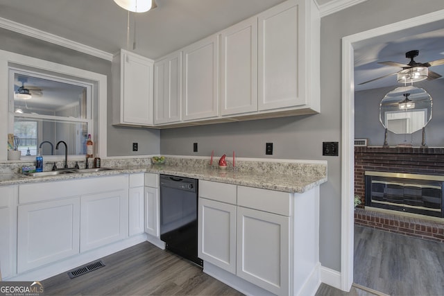 kitchen featuring dishwasher, white cabinetry, dark wood-type flooring, and sink