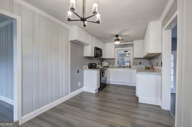 kitchen with sink, white cabinetry, dark wood-type flooring, and black appliances