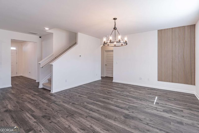 interior space with dark hardwood / wood-style flooring and a notable chandelier