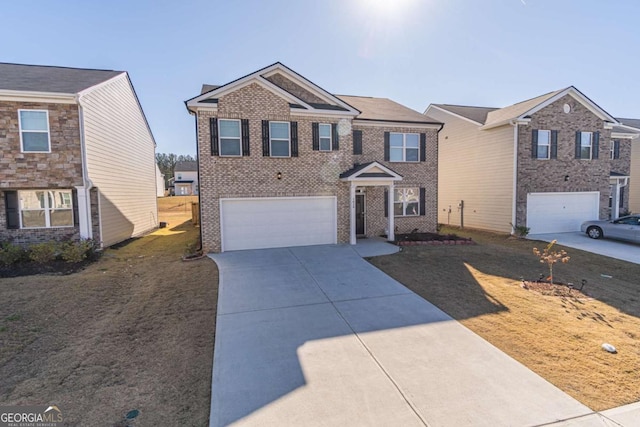 view of front of home with a garage and a front yard