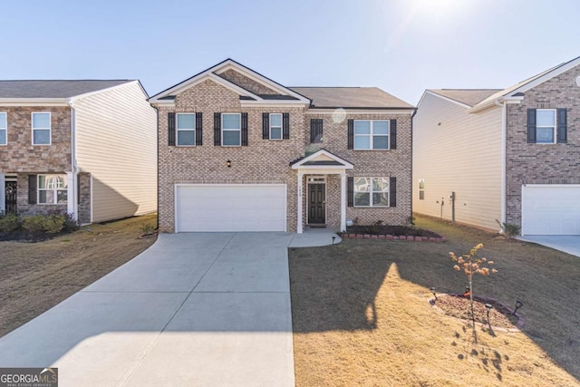 view of front of house with a garage and a front lawn