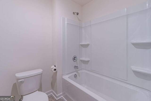 bathroom with toilet and tub / shower combination