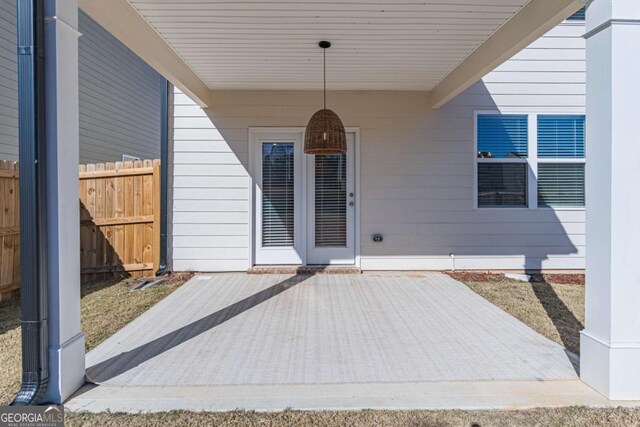 doorway to property featuring a patio