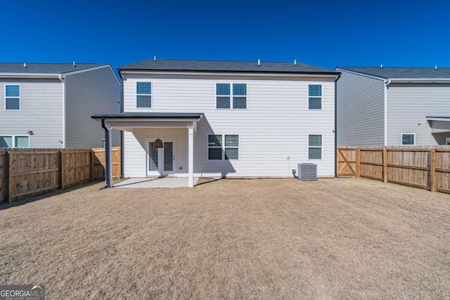 back of house with central air condition unit and a patio