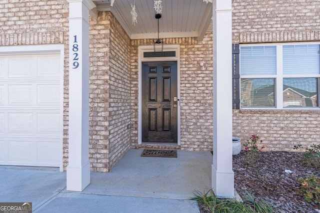 view of exterior entry with covered porch