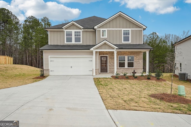 view of front of property with a lawn and a garage