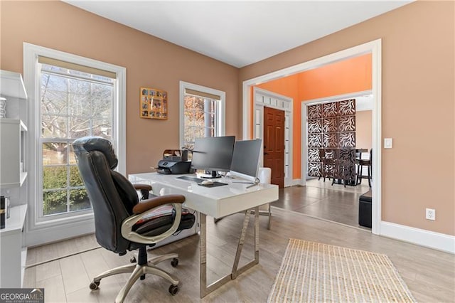 office with light hardwood / wood-style floors