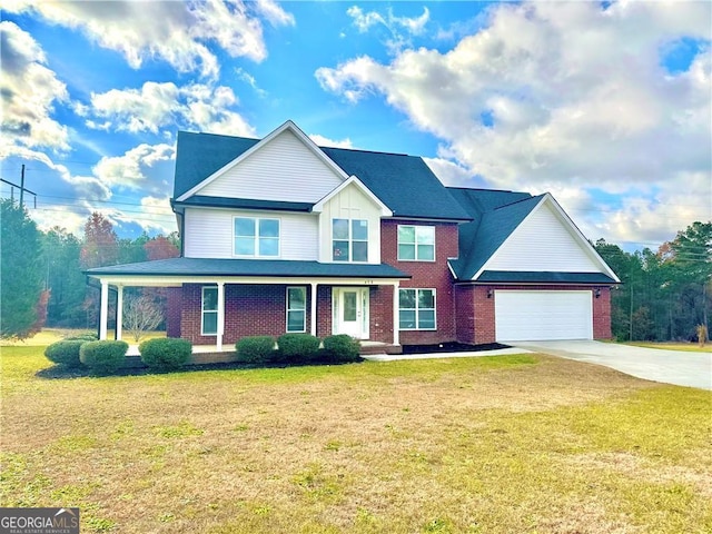 view of front of home with a front lawn and a garage