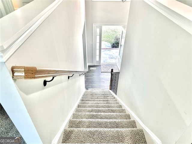 staircase featuring hardwood / wood-style flooring