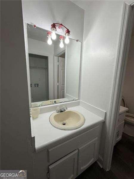 bathroom with vanity and toilet