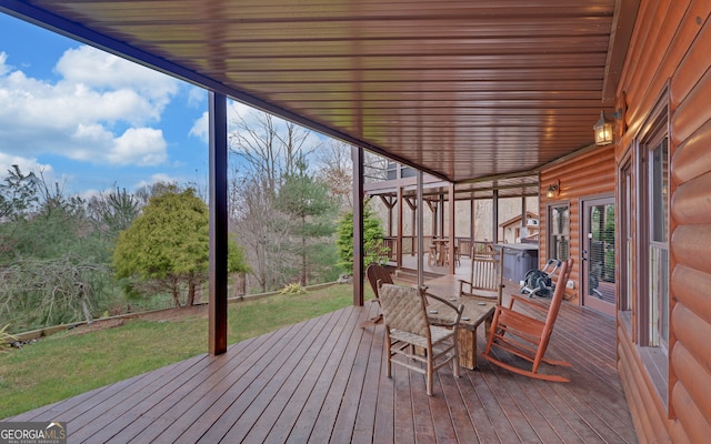 wooden deck with a yard