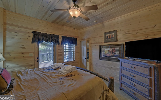 bedroom with access to exterior, wood walls, ceiling fan, and wood ceiling