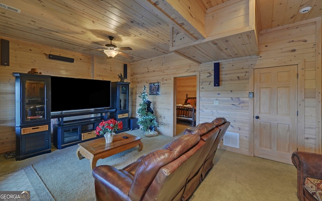 living room with ceiling fan, wood walls, wooden ceiling, and light carpet