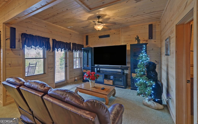 carpeted living room featuring ceiling fan, wood ceiling, and wooden walls