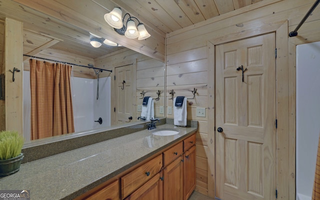 bathroom with vanity, wood ceiling, and wooden walls