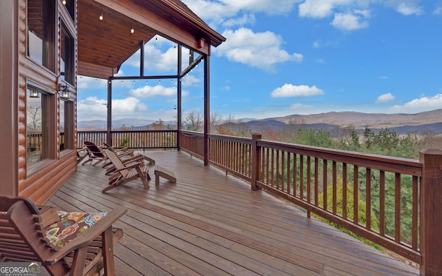 wooden terrace featuring a mountain view