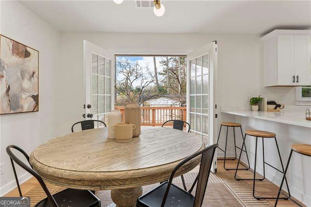 dining room featuring light hardwood / wood-style flooring