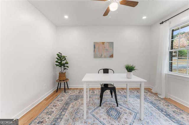 office space featuring hardwood / wood-style flooring and ceiling fan