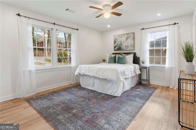 bedroom featuring light wood-type flooring and ceiling fan