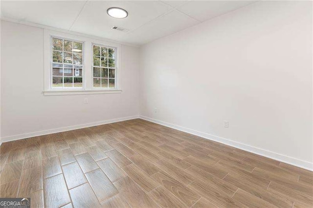 unfurnished room featuring wood-type flooring