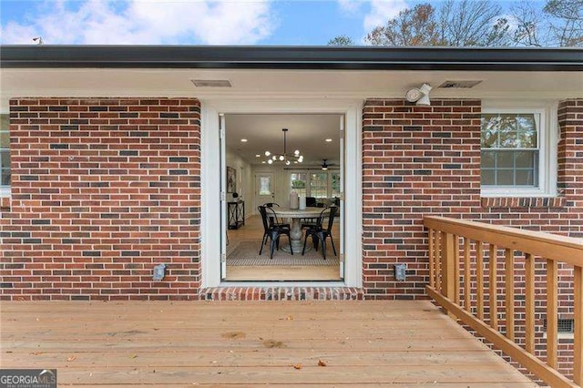 doorway to property featuring a deck