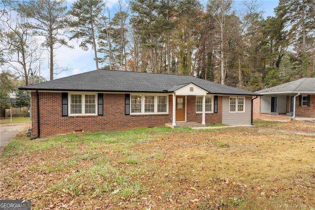 ranch-style home featuring a front yard