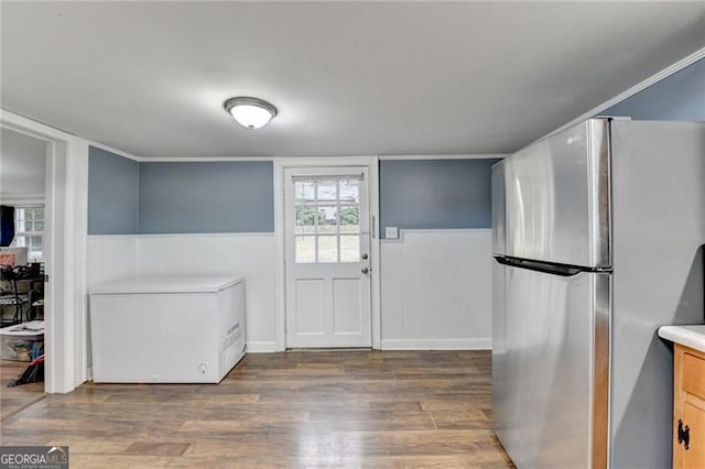 interior space featuring dark hardwood / wood-style floors, stainless steel fridge, and fridge