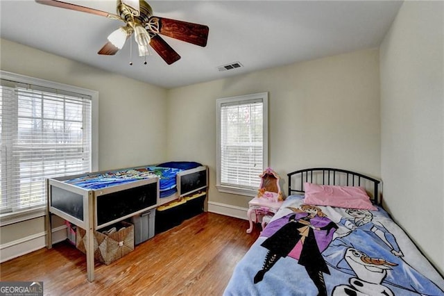 bedroom with ceiling fan and wood-type flooring