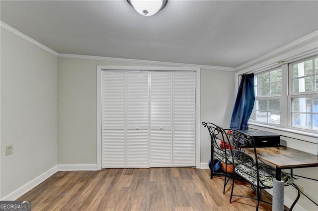 office area featuring ornamental molding, vaulted ceiling, and hardwood / wood-style flooring