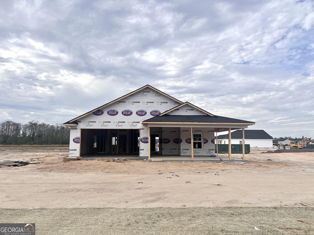 unfinished property with a porch