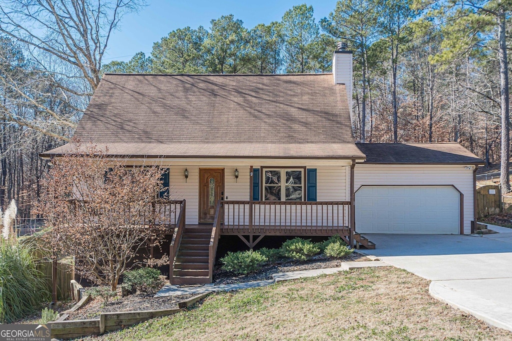 view of front facade featuring covered porch and a garage