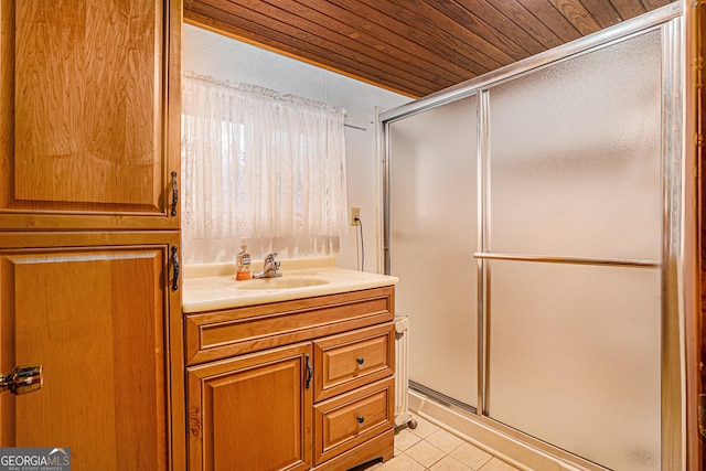 bathroom with vanity, tile patterned floors, a shower with door, and wooden ceiling